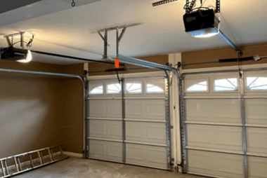 Two new garage doors fitted with automatic openers