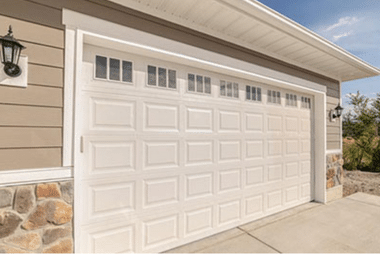 New white sectional garage door on a residential home