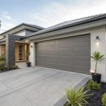Modern home exterior with a woodland grey garage door