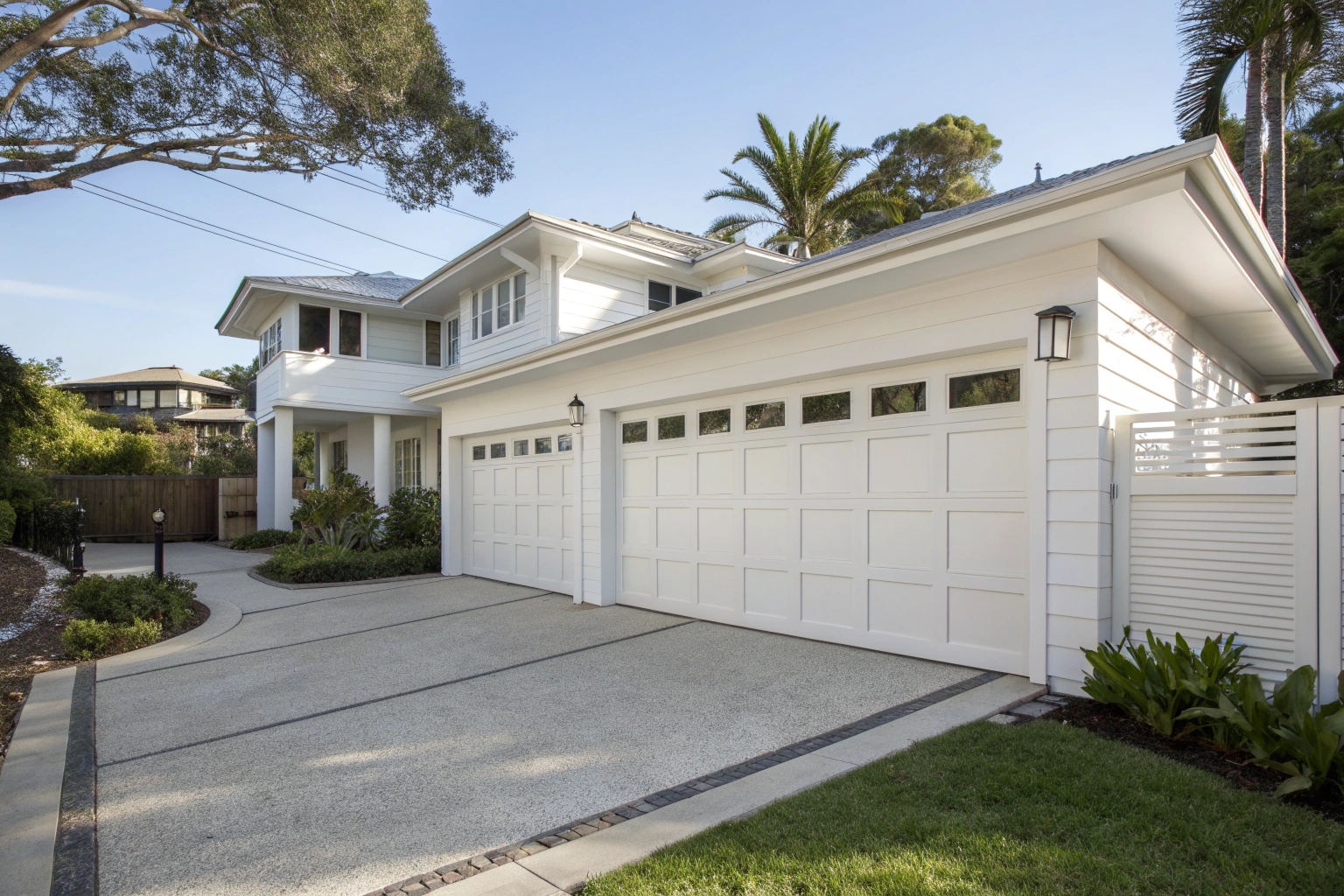Modern home exterior with a pristine white garage door